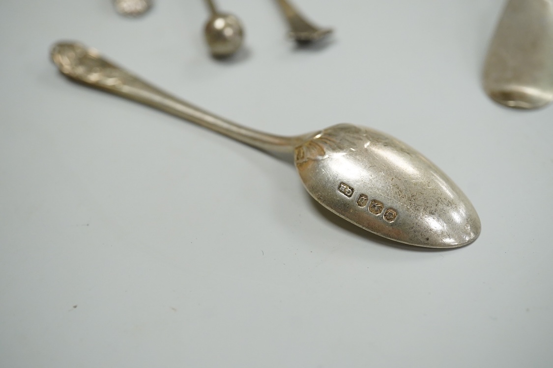 A continental white metal beaker, 69mm, five late Victorian silver coffee spoons, a silver pusher and butter knife and three white metal items.